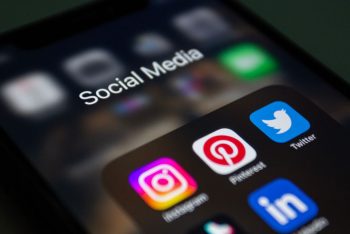 A smartphone screen displaying popular social media applications like Instagram and Twitter.